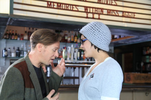 Minnie Wohl (Charly Bivona) and J.P. Porter (J.D. Oxblood) argue about seeing a movie in the bar of the Nitehawk Cinema in Williamsburg in the film Hashtag Annie Hall http://hashtaganniehall.nyc/